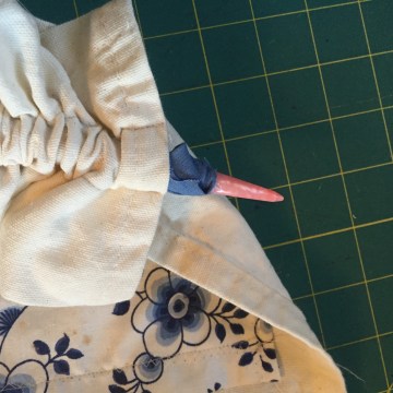 I had to get the bias tape through the seam...knitting needle
